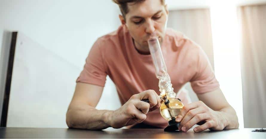 Man smoking a bong
